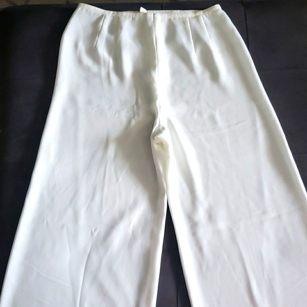 White/ cream color. Wide legs pants